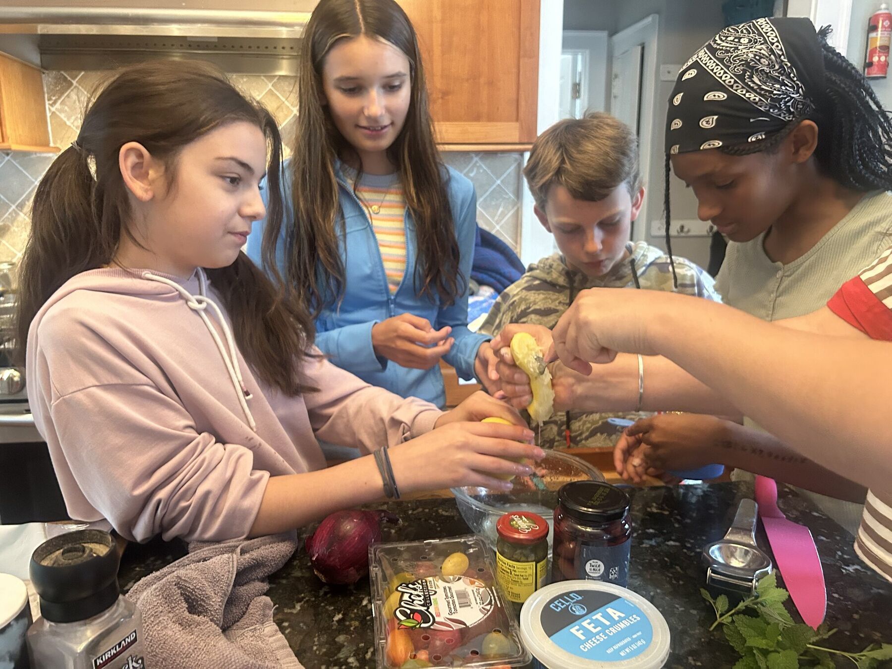 Kids cooking together at the stove